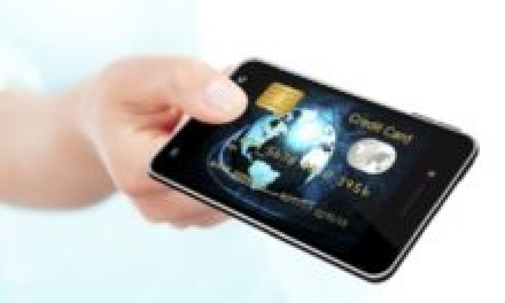 hand holding mobile phone with credit card screen isolated over white background